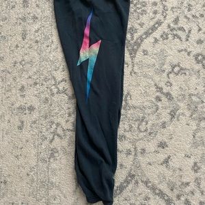 Aviator Nation size small charcoal sweat pants with neon rainbow lightening bolt